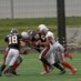 1プレイ目からビックゲインを許し、懸命のパシュートでタックルに行く DB#20田口